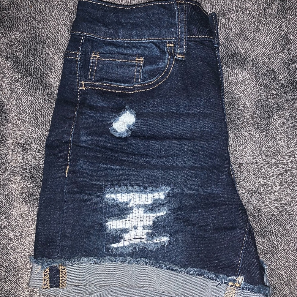 Dark blue ripped jean shorts